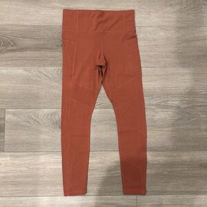 Athleta rust colored moto leggings with pockets